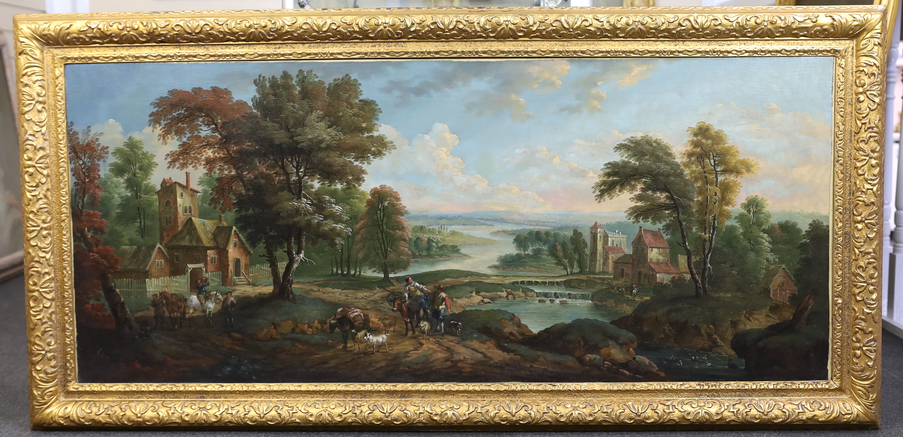 Flemish School , Extensive pastoral landscape with figures on their way to market, oil on canvas, 63 x 147cm